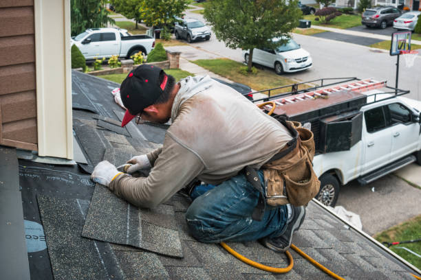 Professional Roofing technician working in Springs, NY